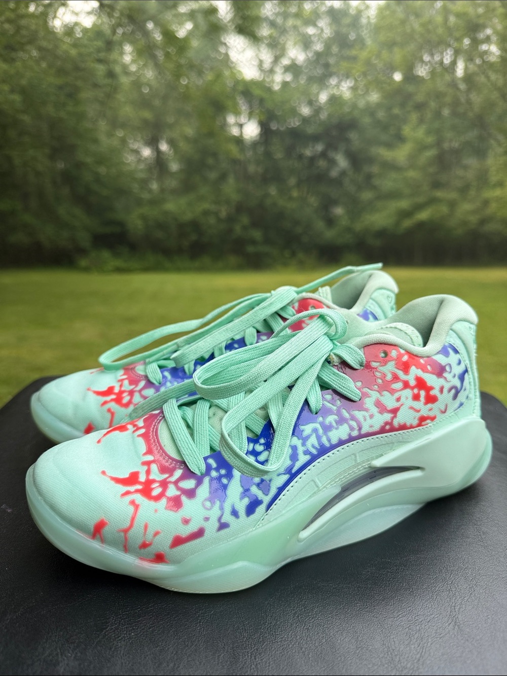 Jordan Zion 3 GS (Grade School) in the "Mud, Sweat, and Tears" colorway.